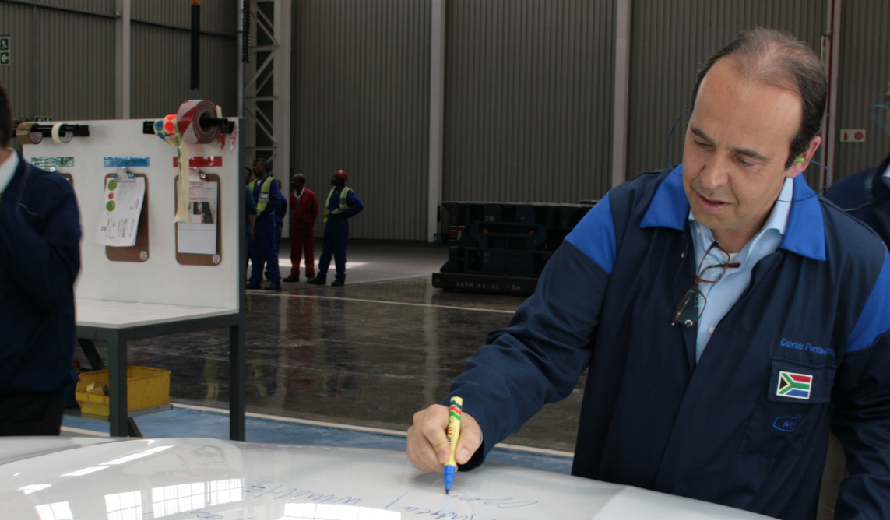 Gabriele Perris Magnetto, CEO, signing a bonnet during the inauguration of the new line